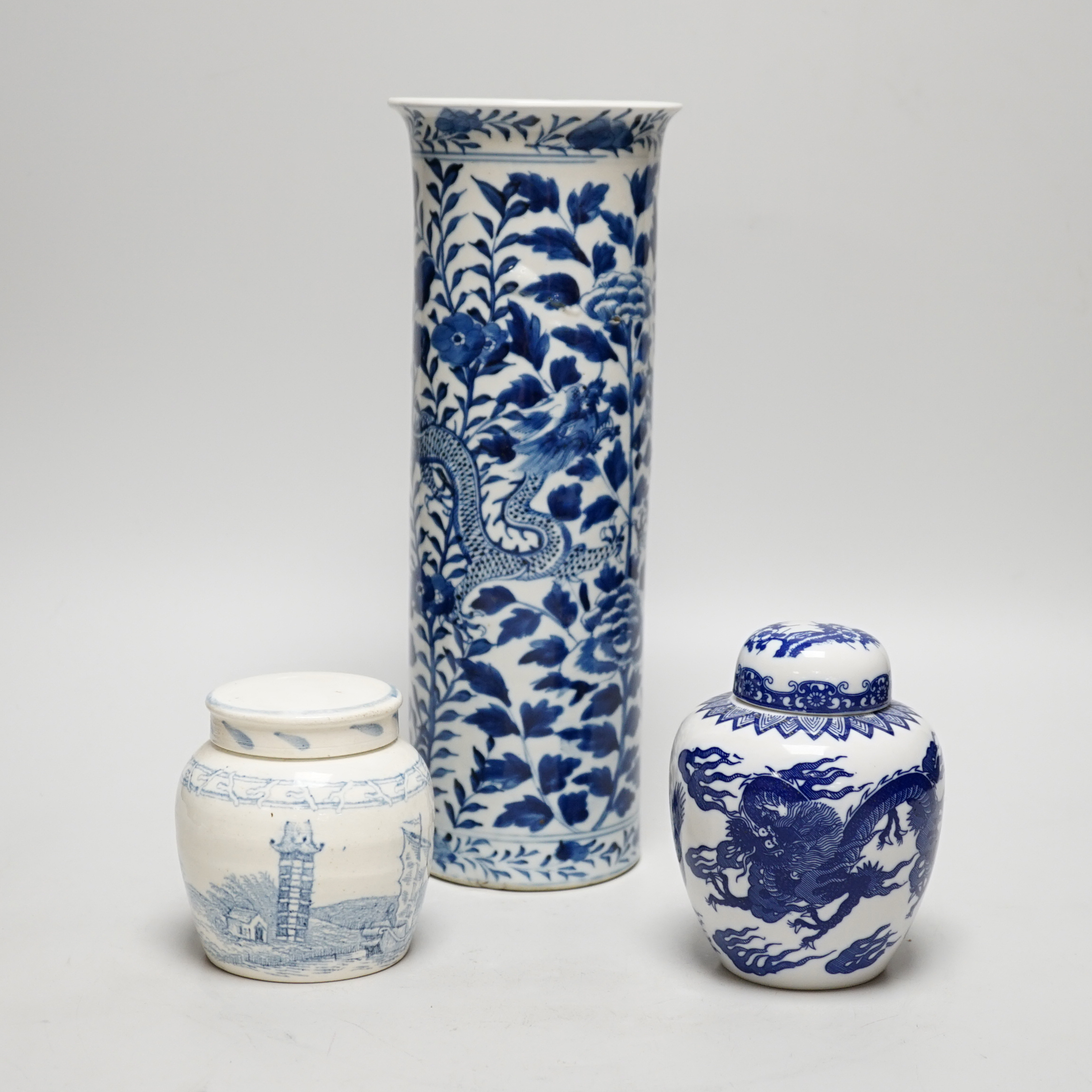 An early 20th century Chinese vase together with two small jars with covers, highest 31cm